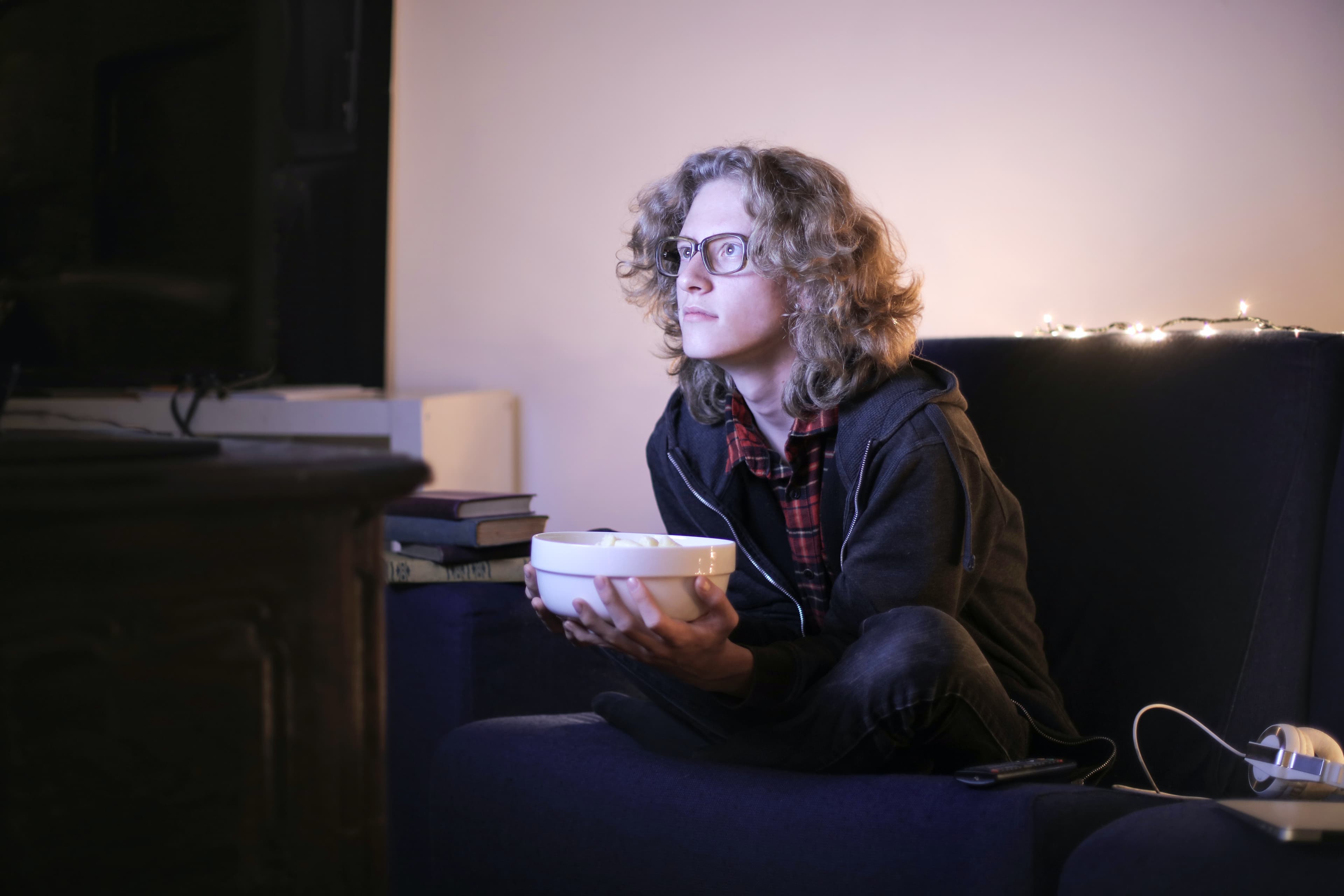 Person watching a movie, photo by Andrea Piacquadio